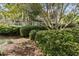 Building exterior partially obscured by trees and landscaping at 1616 Live Oak Park, Seabrook Island, SC 29455