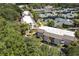 Aerial view of condo building near tennis courts and lush greenery at 1616 Live Oak Park, Seabrook Island, SC 29455