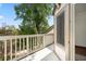 Private balcony with white railing and tree views at 1616 Live Oak Park, Seabrook Island, SC 29455