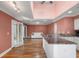 Open kitchen with granite countertops, stainless steel appliances, and hardwood floors at 1616 Live Oak Park, Seabrook Island, SC 29455
