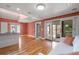 Open concept living area with hardwood floors and access to a balcony and patio at 1616 Live Oak Park, Seabrook Island, SC 29455