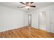 Spacious bedroom with hardwood floors, ceiling fan and access to a hallway at 1616 Live Oak Park, Seabrook Island, SC 29455