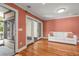 Living room with hardwood floors, sliding glass doors to deck, and a white sofa at 1616 Live Oak Park, Seabrook Island, SC 29455