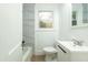 Clean bathroom featuring marble tile and modern vanity at 3981 Niagara St, North Charleston, SC 29405