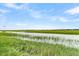 Serene view of the marsh grasses and water at 250 Little Oak Dr # 250, Folly Beach, SC 29439