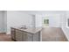 Kitchen island with granite countertop, double sink, and stainless steel appliances at 369 Willows Crescent Dr, Moncks Corner, SC 29461