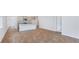 Open living area with hardwood floors and kitchen island visible in the background at 369 Willows Crescent Dr, Moncks Corner, SC 29461
