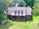 Brick house with metal roof, large porch, and spacious yard at 1813 Albert Storm Ave, Moncks Corner, SC 29461