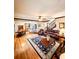 Open living room with hardwood floors, leather furniture, and access to kitchen and dining areas at 1813 Albert Storm Ave, Moncks Corner, SC 29461