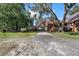 Brick house exterior with gravel driveway and landscaping at 1813 Albert Storm Ave, Moncks Corner, SC 29461