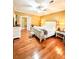Spacious primary bedroom with hardwood floors and a king-size bed at 1813 Albert Storm Ave, Moncks Corner, SC 29461