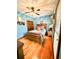 Bedroom with hardwood floors, ceiling fan, and blue walls at 1813 Albert Storm Ave, Moncks Corner, SC 29461