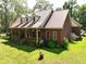 Brick home with metal roof and front porch at 1813 Albert Storm Ave, Moncks Corner, SC 29461