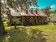 Brick house with metal roof, large porch, and spacious yard at 1813 Albert Storm Ave, Moncks Corner, SC 29461