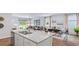 Modern kitchen island with granite countertops and stainless steel sink at 357 Willows Crescent Dr, Moncks Corner, SC 29461