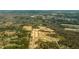 Aerial view of a new neighborhood with homes and roads near a lake at 357 Willows Crescent Dr, Moncks Corner, SC 29461