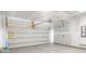 Clean, empty garage with white walls, concrete floor, and functional garage door mechanism at 405 Peachwood Ln, Moncks Corner, SC 29461