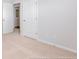 Simple bedroom with neutral carpeting and an attached bathroom at 405 Peachwood Ln, Moncks Corner, SC 29461