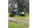 Small house with a blue tarp on the roof at 1632 Central Ave, Summerville, SC 29483