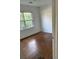 Bright bedroom with hardwood floors and large window at 109 Lewis St, Walterboro, SC 29488