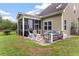 Outdoor screened porch with patio furniture and grilling area at 1229 Updyke Dr, Johns Island, SC 29455