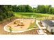 Community playground with playset, swings, and pond nearby at 144 Carolina Groves Blvd, Moncks Corner, SC 29461