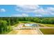 Community pool, playground, and pond are featured in this aerial view at 156 Carolina Groves Blvd, Moncks Corner, SC 29461