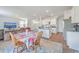 Open concept dining area with kitchen views and wood flooring at 124 Blossom Wood Ln, Summerville, SC 29486