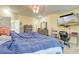 Main bedroom with large bed, dresser, and home office at 7002 Sassafrass Ct, Summerville, SC 29485