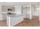 Modern kitchen with gray cabinets, granite counters and island at 189 Morning View Way, Moncks Corner, SC 29461