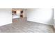 Open living room with wood-look flooring and kitchen view at 374 Willows Crescent Dr, Moncks Corner, SC 29461