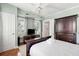 Bedroom with a dark brown wooden bed frame and dresser at 167 Coming St, Charleston, SC 29403
