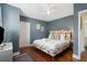 King-size bed with floral headboard in a blue room at 167 Coming St, Charleston, SC 29403