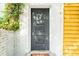 Dark gray front door with decorative detailing at 167 Coming St, Charleston, SC 29403