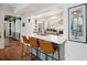 Modern kitchen features stainless steel appliances and a breakfast bar with seating at 167 Coming St, Charleston, SC 29403