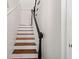White and black staircase with wooden steps at 167 Coming St, Charleston, SC 29403