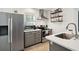 Modern kitchen with stainless steel appliances and gray cabinets at 167 Coming St, Charleston, SC 29403