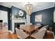 Elegant dining room features a wood table and a modern chandelier at 167 Coming St, Charleston, SC 29403