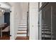 Interior view of a wooden staircase with white walls at 167 Coming St, Charleston, SC 29403