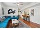 Open living and kitchen area with teal sectional sofa at 167 Coming St, Charleston, SC 29403