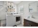 Laundry room with washer, dryer, and vanity at 167 Coming St, Charleston, SC 29403