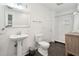Bathroom with white subway tile shower, white vanity, and dark gray floor at 167 Coming St, Charleston, SC 29403