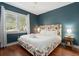 Spacious bedroom with a king-size bed and a blue accent wall at 167 Coming St, Charleston, SC 29403