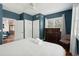 Serene bedroom with king-size bed, dark-wood dresser and blue walls at 167 Coming St, Charleston, SC 29403