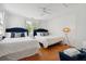 Two twin beds with navy headboards in bright bedroom at 167 Coming St, Charleston, SC 29403