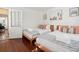Bedroom with two twin beds, hardwood floors, and a white door at 167 Coming St, Charleston, SC 29403