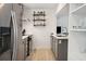 Gray shaker cabinets, stainless steel appliances, and wood-look tile floors at 167 Coming St, Charleston, SC 29403