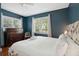 Bedroom with king-size bed, dresser, and two windows with blinds at 167 Coming St, Charleston, SC 29403