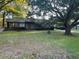 Brick ranch home with a large tree and tire swing at 1717 Pinecrest Rd, Charleston, SC 29407
