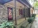 Brick home with covered porch and red shutters at 1717 Pinecrest Rd, Charleston, SC 29407